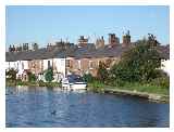 Canal-side cottages Copyright Bryan Pready and licensed for reuse  under this Creative Commons Licence