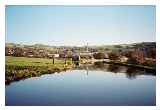 Low Bradley in Airedale with its old mill reflected © William Nicholson