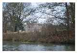 Lilford Hall through the trees